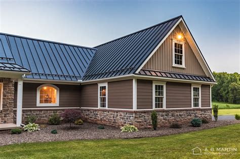 brick house with black metal roof|metal roofing for homes photos.